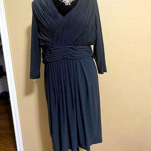 Navy blue, knee length dress.